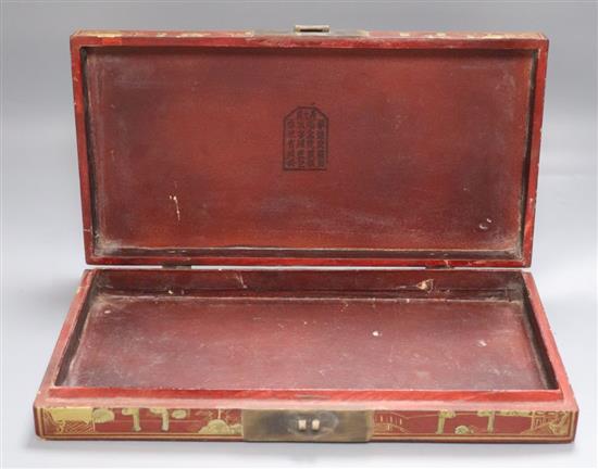 A Chinese red lacquer box, gilded with figures and landscape, width 38cm